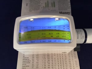 Illuminated stand magnifier with line marker