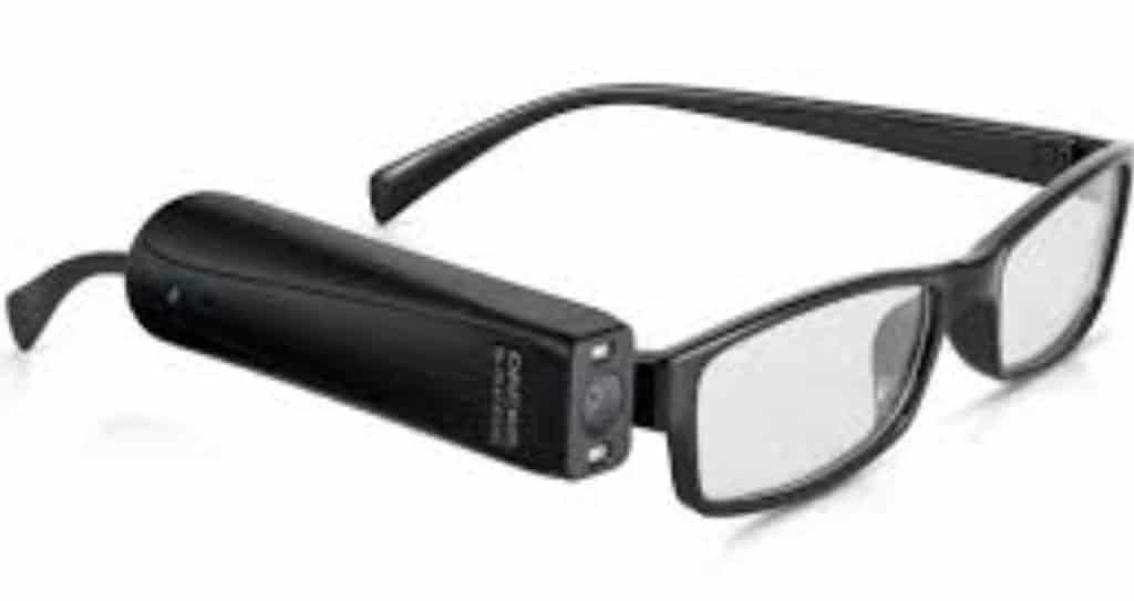 Image of OrCam attached to the right temple of a pair of eyeglass frames
