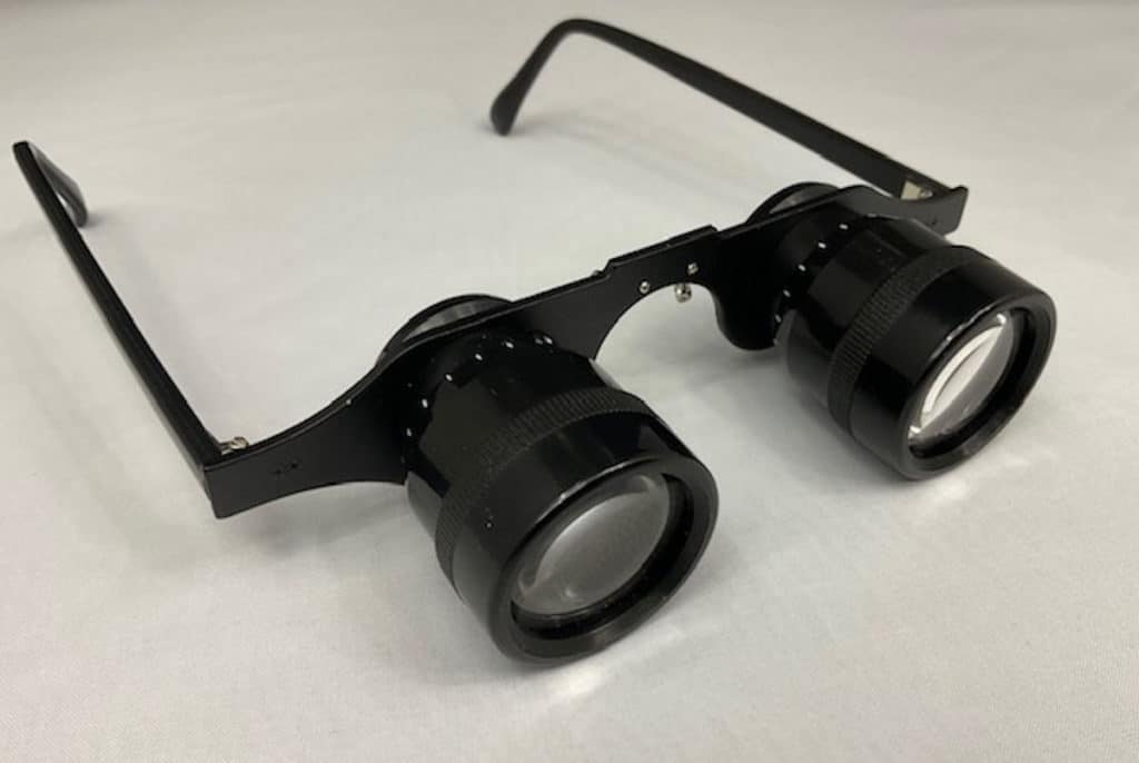 pair of low vision head worn style binoculars
