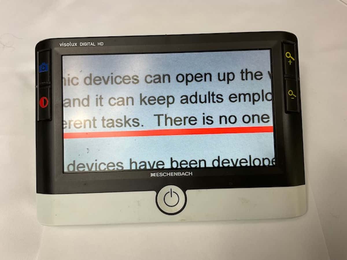 Image of video magnifier with on-screen line marker for reading assistance.