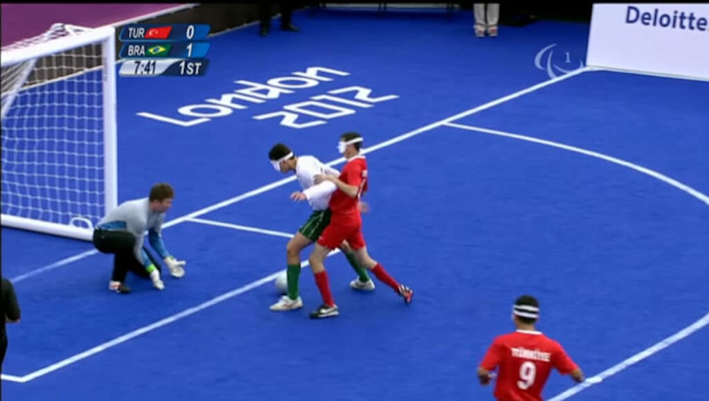 image of the soccor indoor field with 4 players